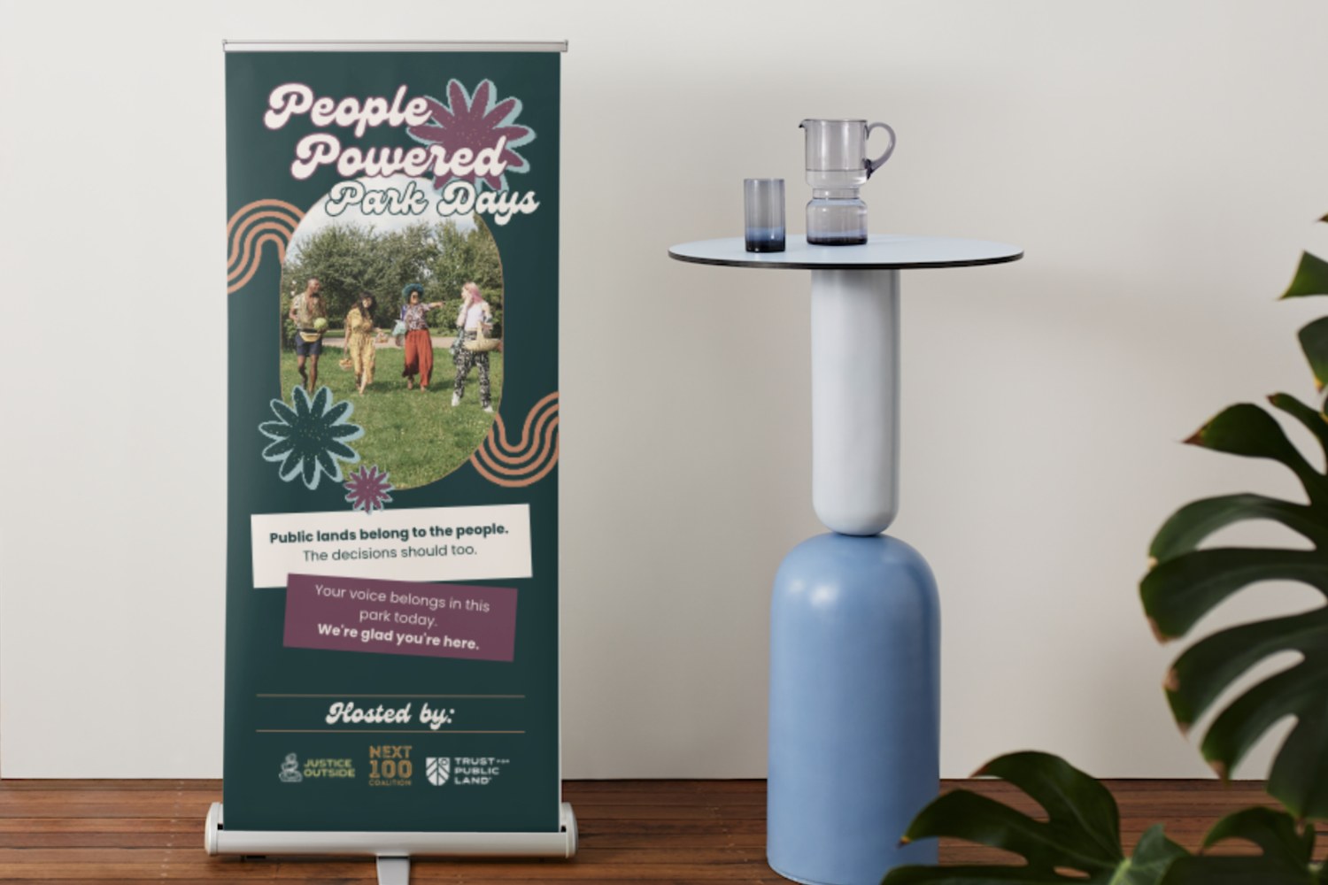 People Powered Park Days retractable banner beside a side table